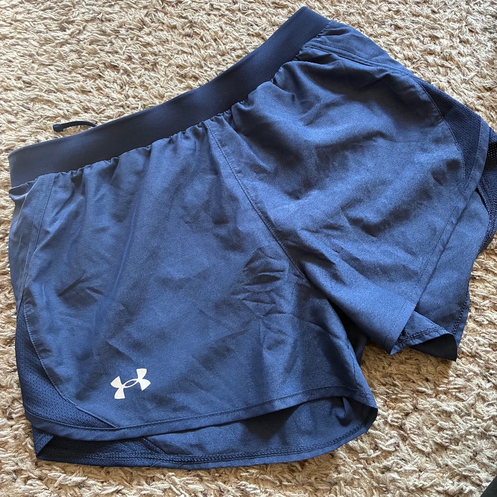 Women’s UA running shorts, navy/black lining, size medium